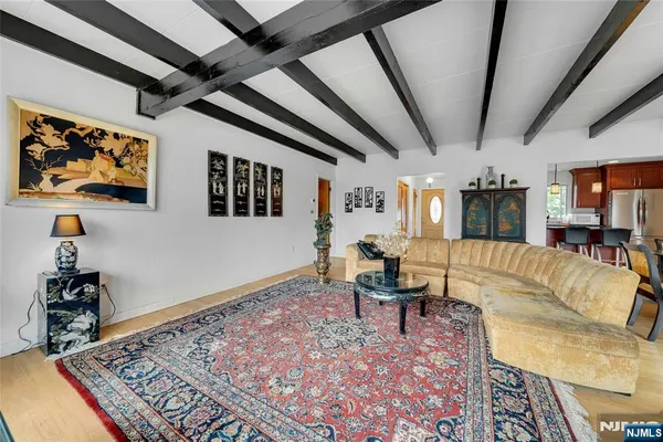a living room with furniture and a rug