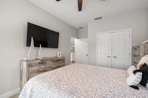 a bedroom with a bed and a cabinets
