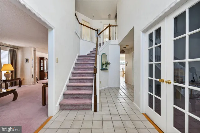 a view of entryway with stairs and wooden floor