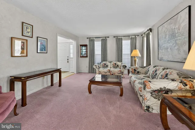 a bedroom with furniture and a wooden floor