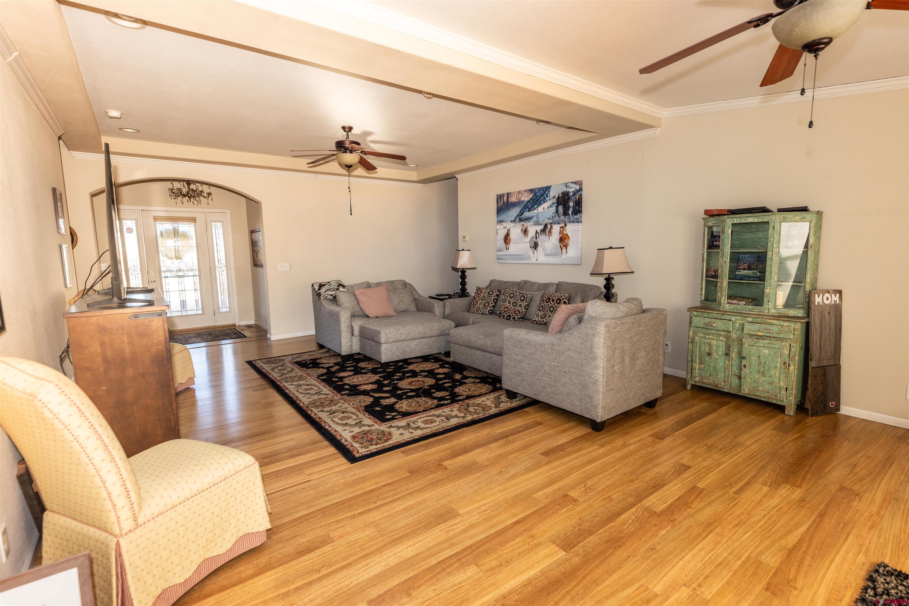 2716 Threemile Road Alamosa, CO 81101 - Photo 12 of 45 a living room with furniture and a wooden floor