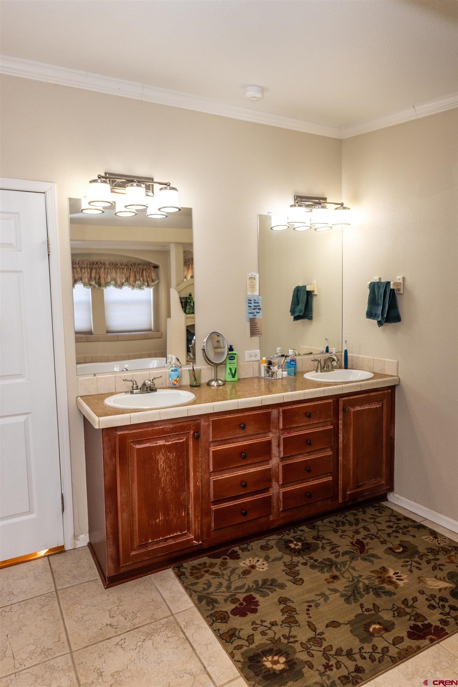 2716 Threemile Road Alamosa, CO 81101 - Photo 18 of 45 a bathroom with a sink and a mirror