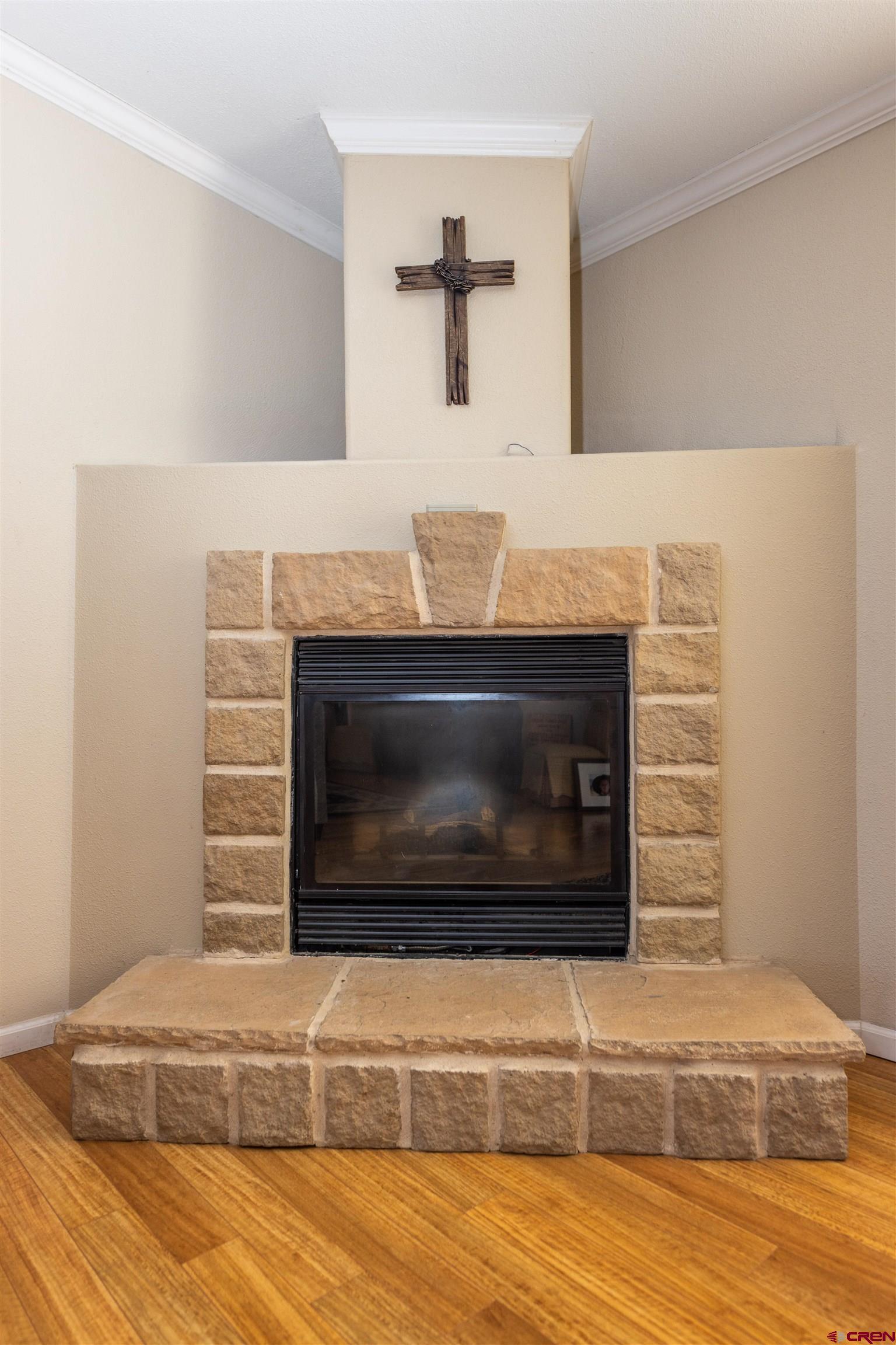 2716 Threemile Road Alamosa, CO 81101 - Photo 25 of 45 a living room with a fireplace
