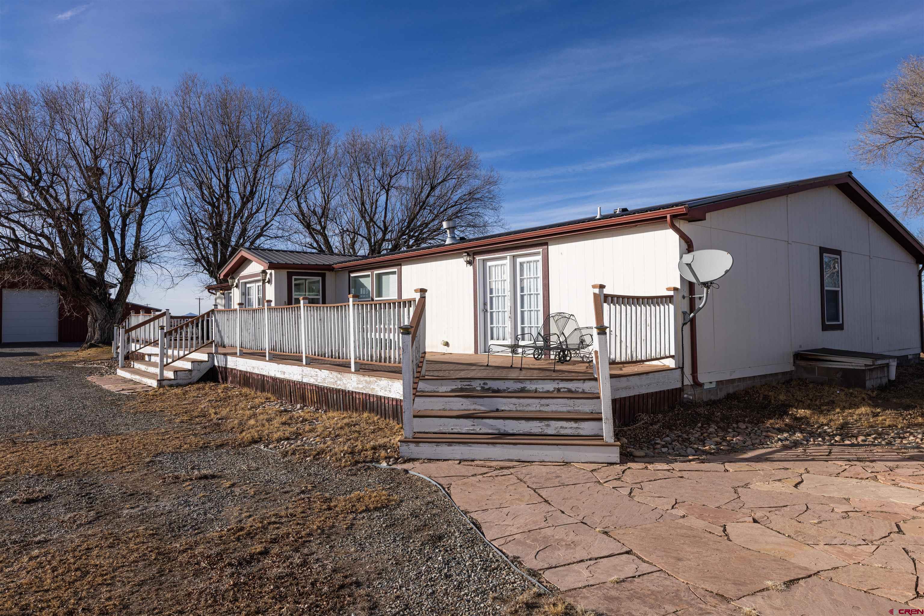 2716 Threemile Road Alamosa, CO 81101 - Photo 35 of 45 a view of a house with a yard