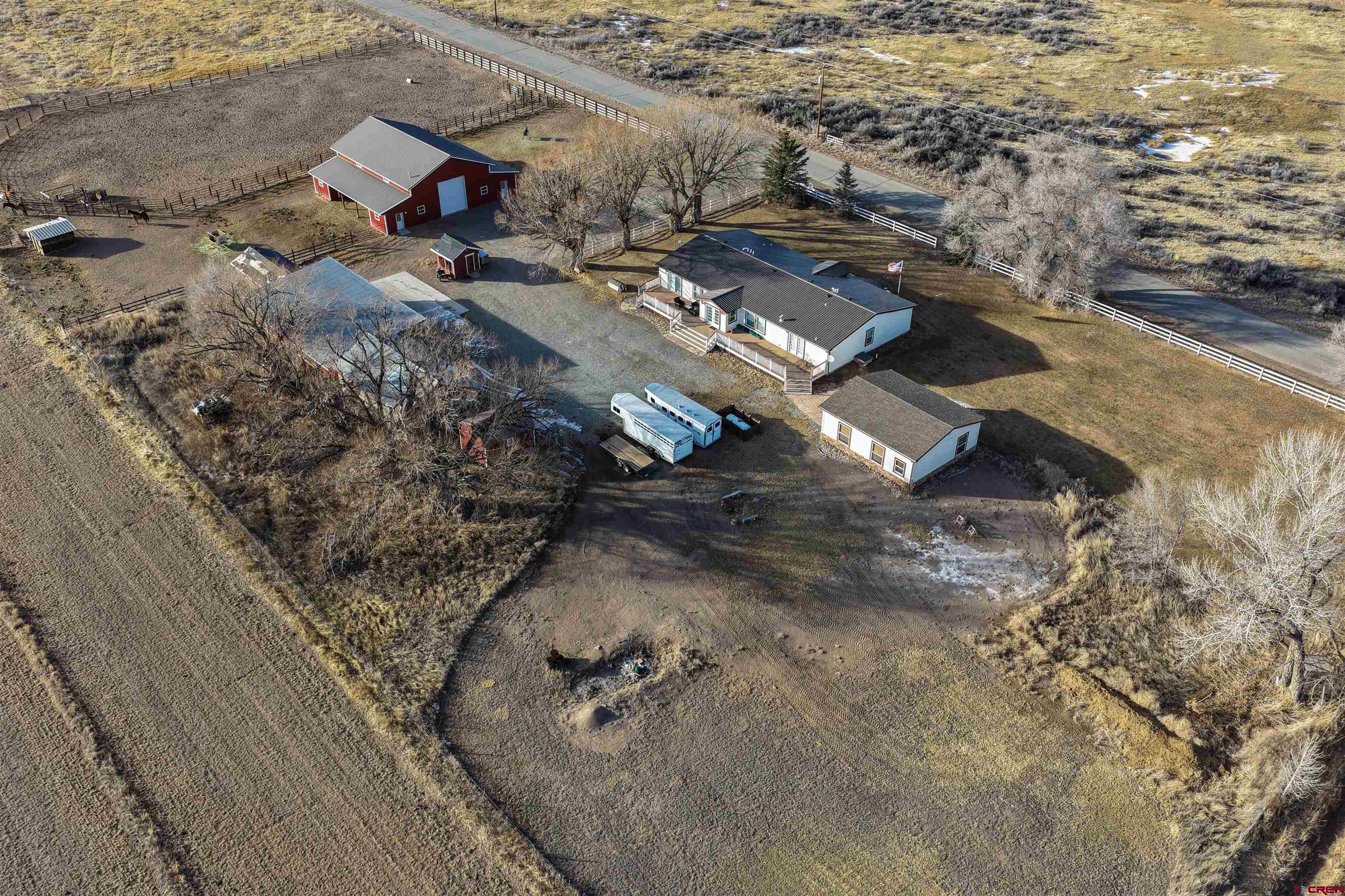 2716 Threemile Road Alamosa, CO 81101 - Photo 45 of 45 an aerial view of residential houses with outdoor space