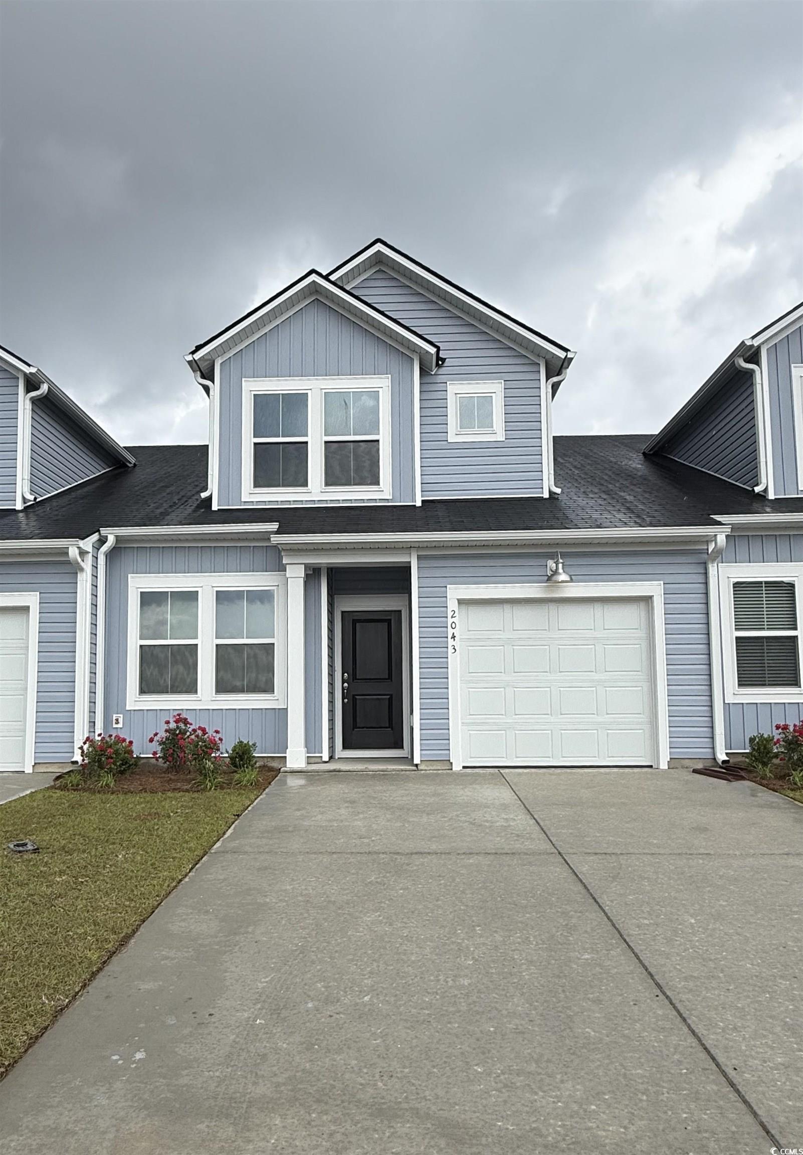 2043 Victory Way, Unit 516 Myrtle Beach, SC 29579 - Photo 1 of 16 View of front of property with a shingled roof and