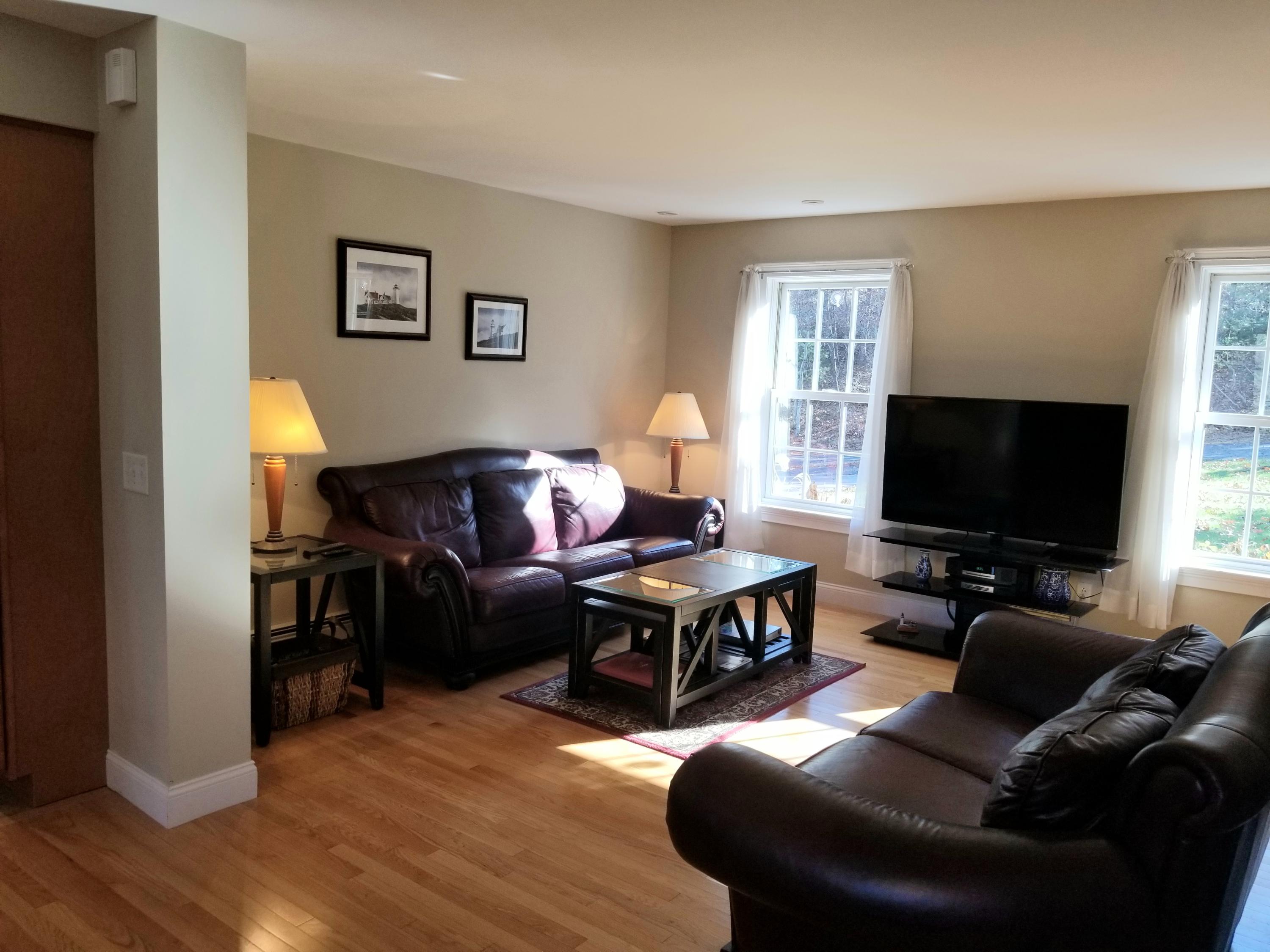 2 Easting Road Bourne, MA 02532 - Photo 3 of 34 a living room with furniture and a flat screen tv