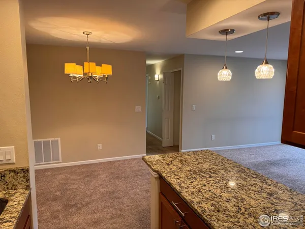wooden floor in an empty room with a mirror
