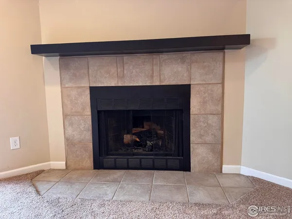a living room with a fireplace