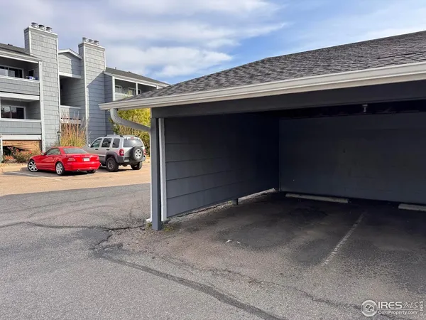 a small pool with couple of relaxing chair