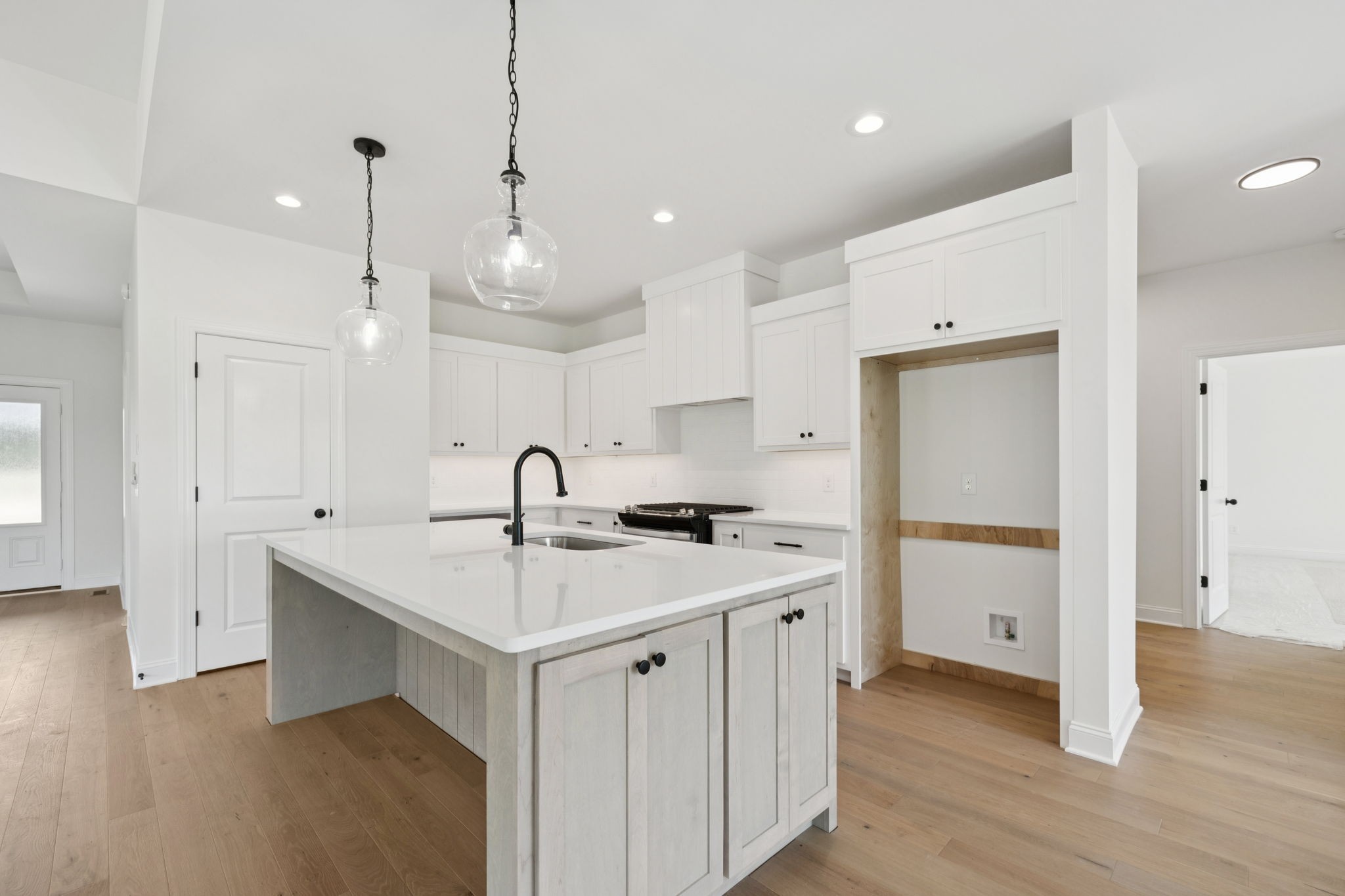 0 Midland Road Bell Buckle, TN 37020 - Photo 13 of 36 a kitchen with a sink a stove a refrigerator and white cabinets
