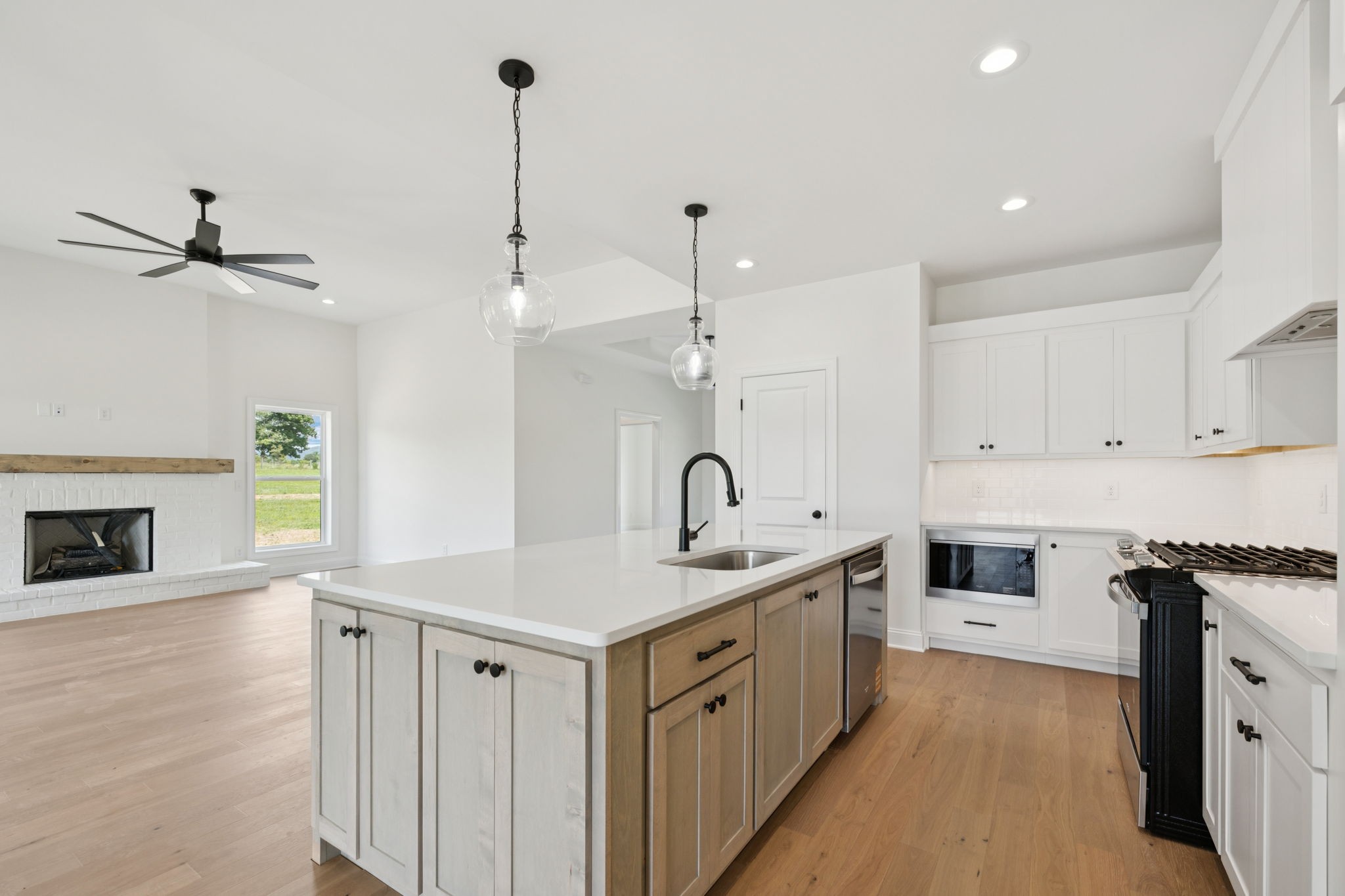 0 Midland Road Bell Buckle, TN 37020 - Photo 15 of 36 a kitchen with a sink stove and cabinets