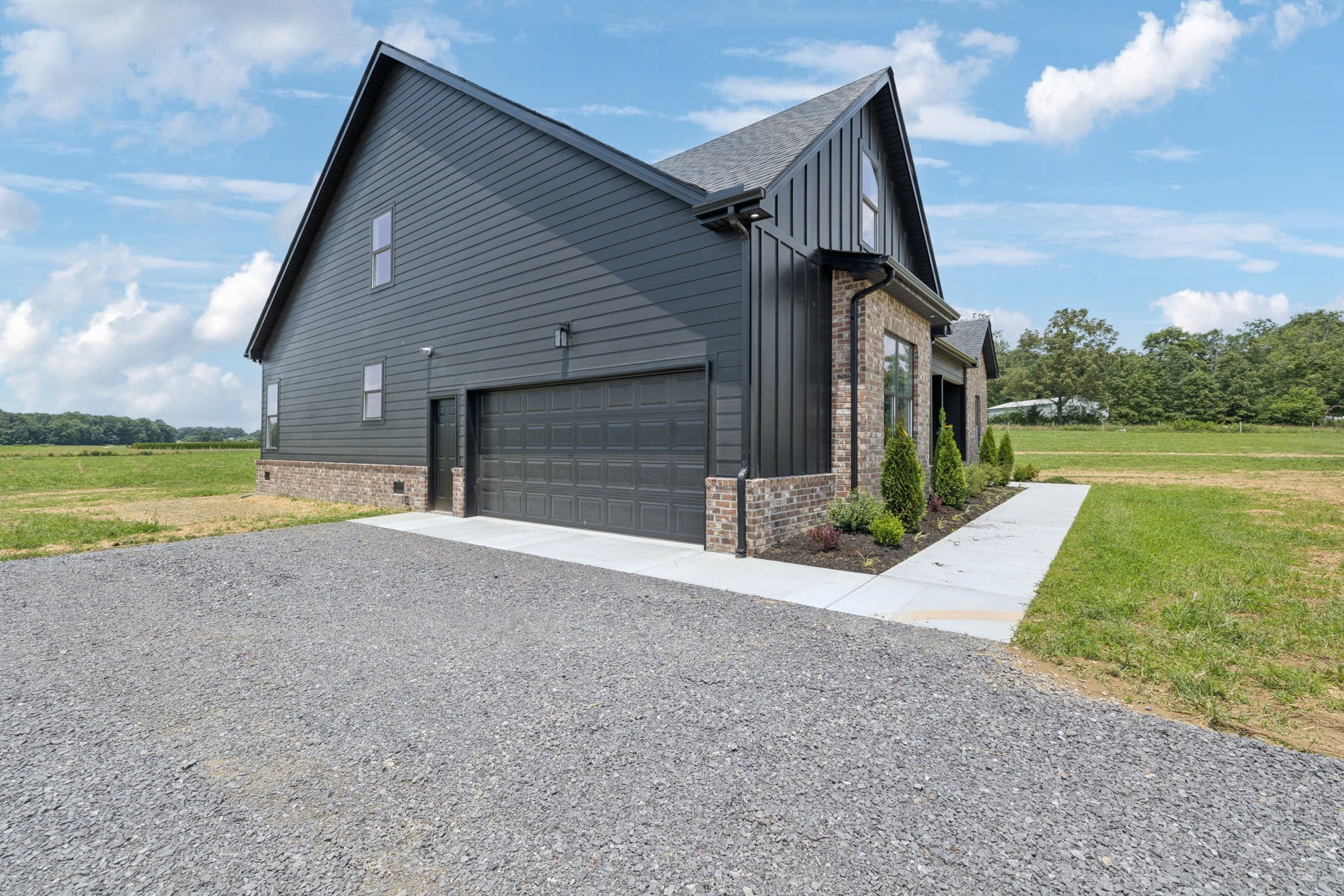 0 Midland Road Bell Buckle, TN 37020 - Photo 2 of 36 a view of a house with a yard and a garage