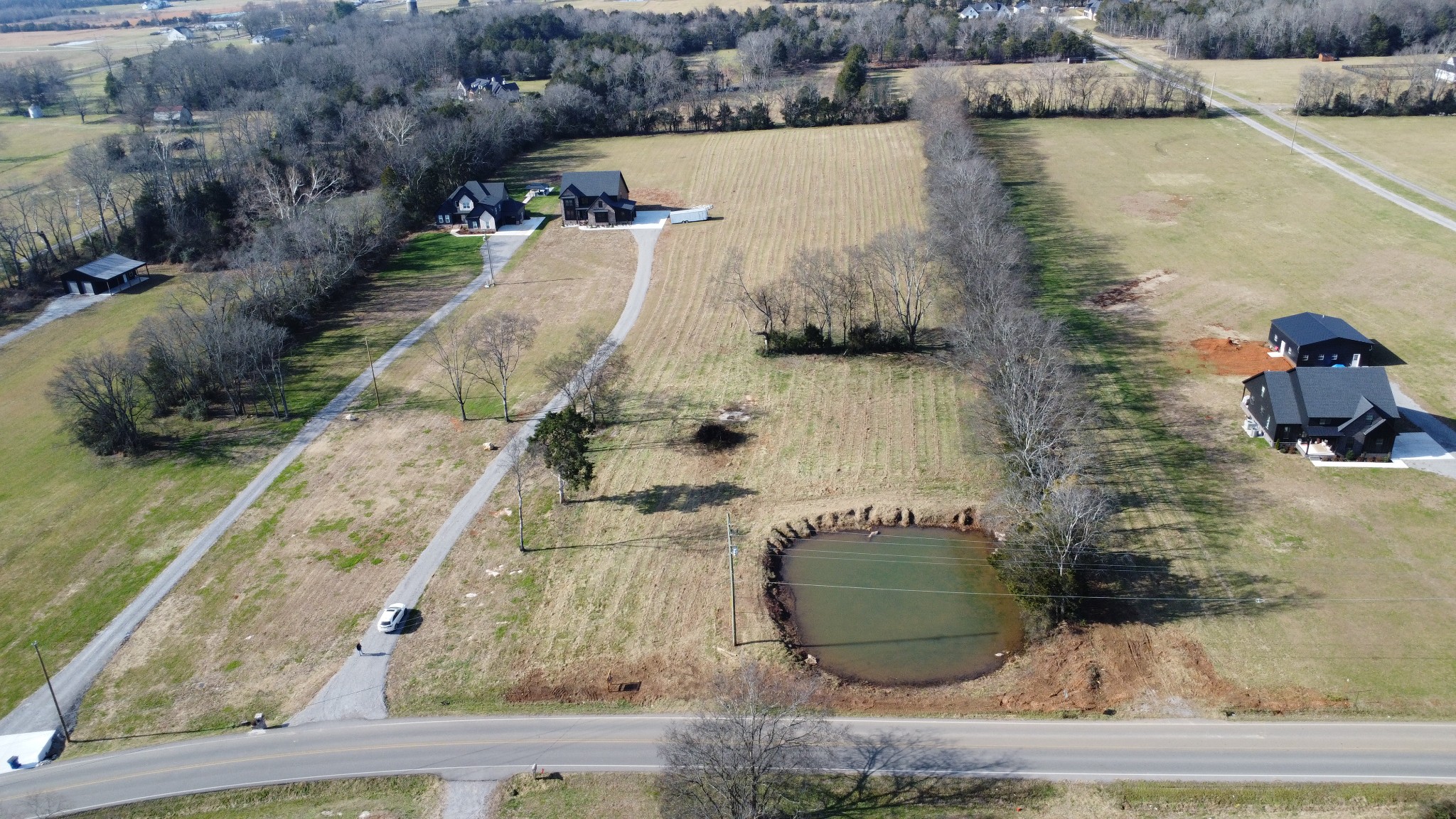 0 Midland Road Bell Buckle, TN 37020 - Photo 35 of 36 a view of a lake with a building in the background
