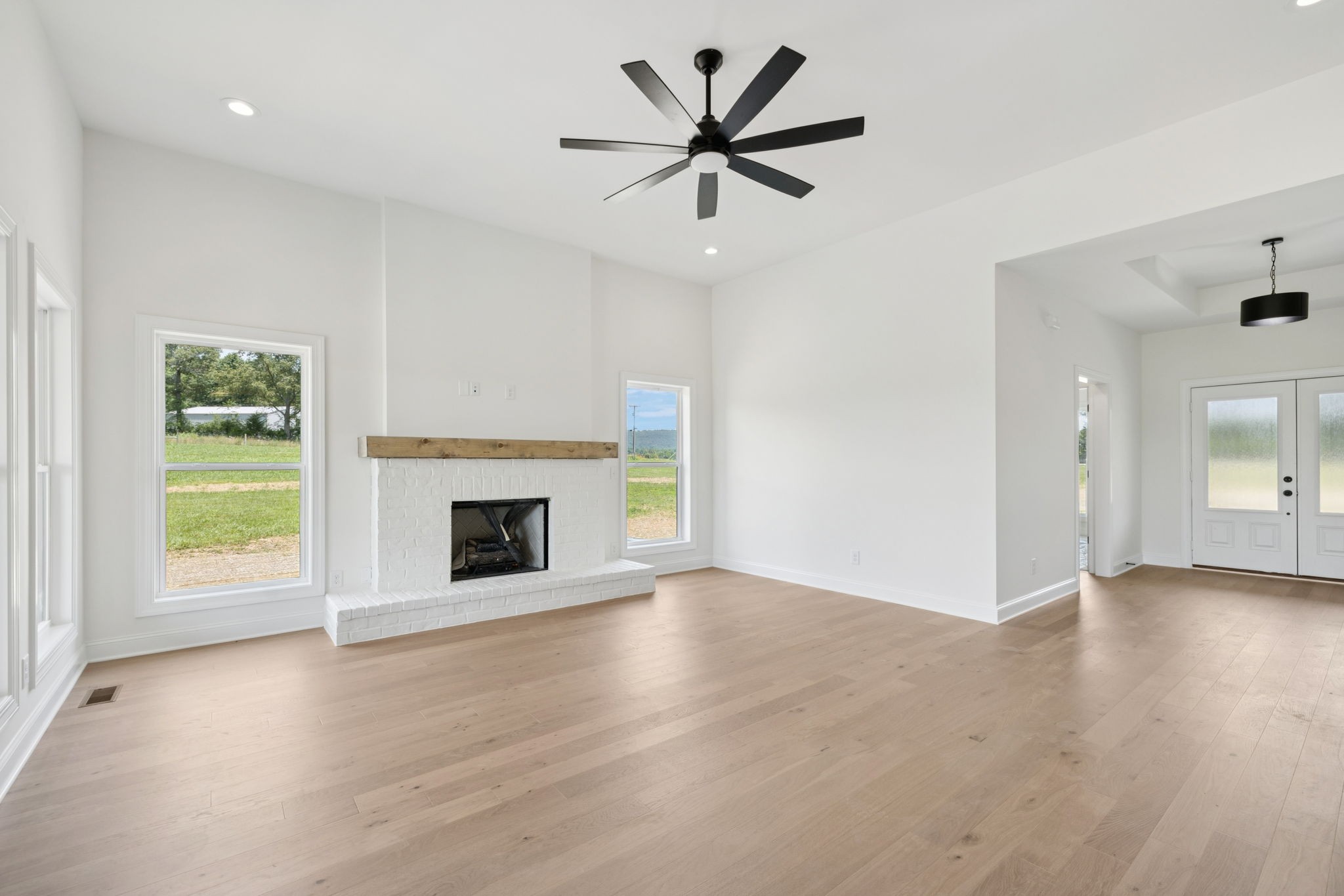 0 Midland Road Bell Buckle, TN 37020 - Photo 6 of 36 an empty room with windows and a fireplace