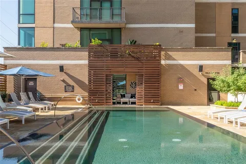 a view of a patio with table and chairs and potted plants