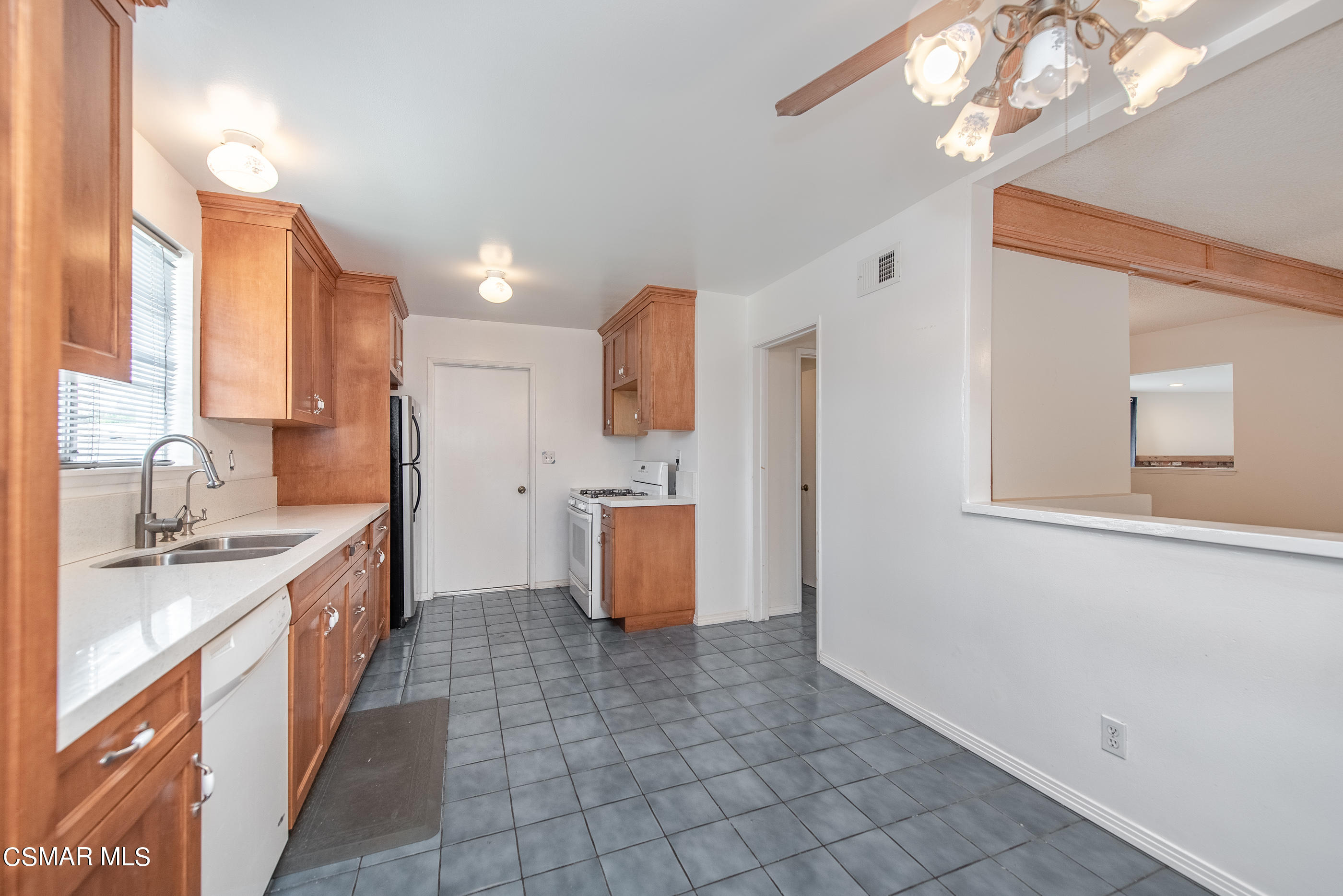1858 Sutter Avenue Simi Valley, CA 93065 - Photo 13 of 24 a large kitchen with a sink a counter top space and cabinets