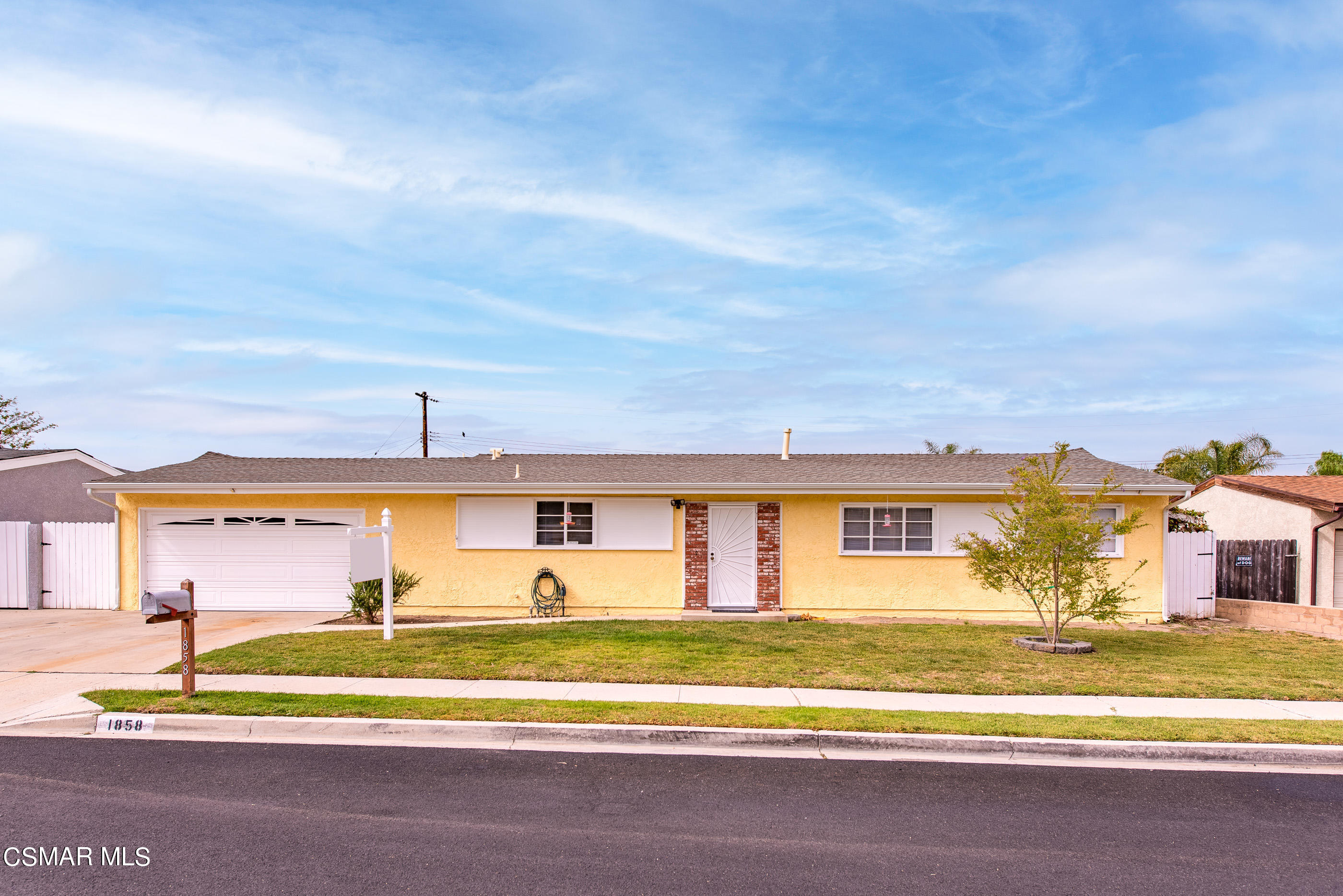 1858 Sutter Avenue Simi Valley, CA 93065 - Photo 3 of 24 a view of a big yard with palm trees