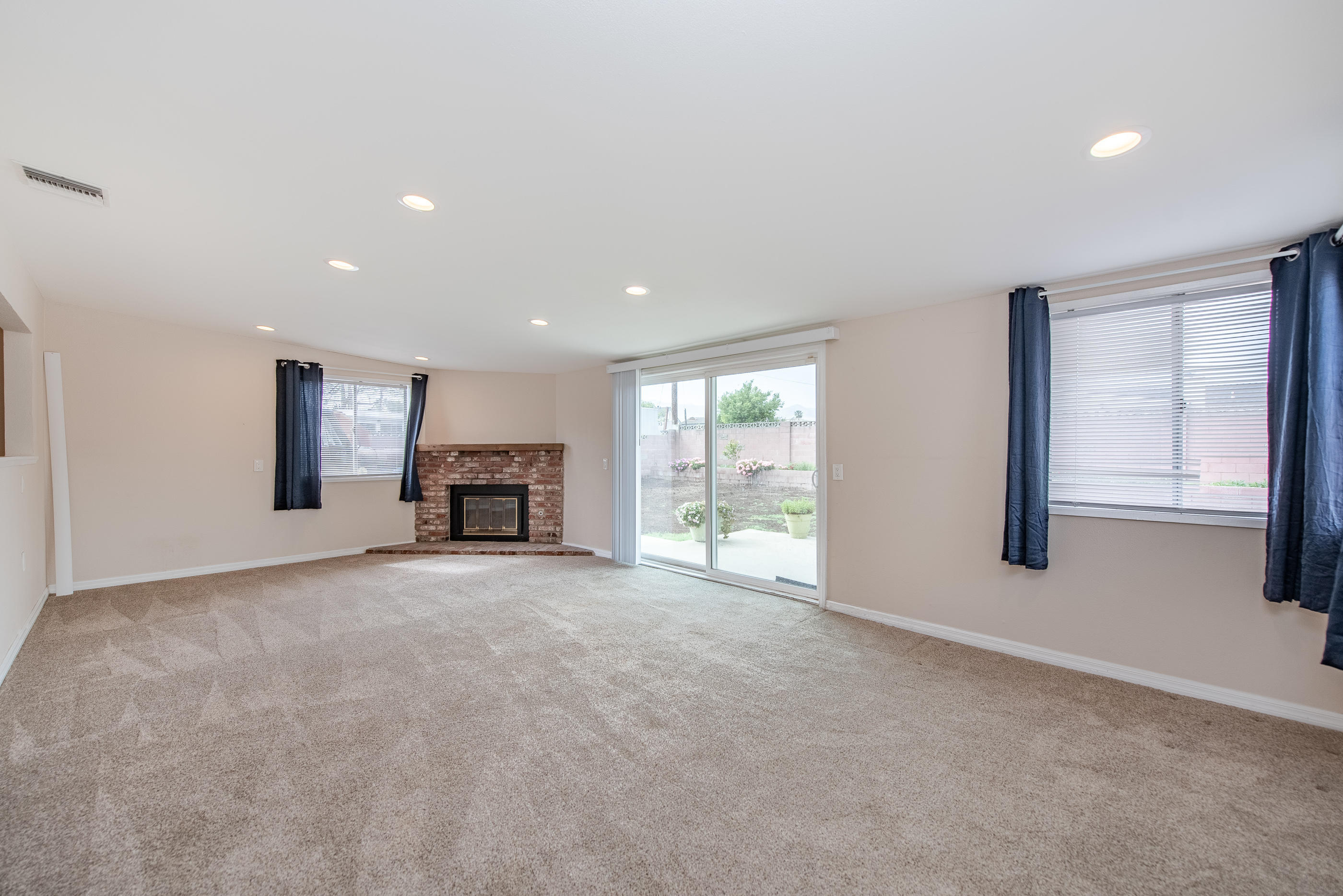 1858 Sutter Avenue Simi Valley, CA 93065 - Photo 4 of 24 a view of an empty room with a window and fireplace