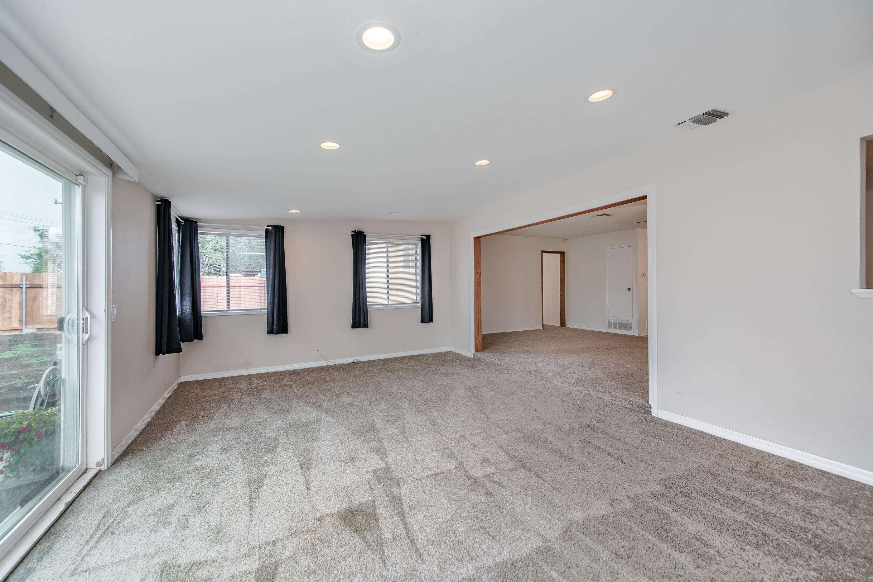 1858 Sutter Avenue Simi Valley, CA 93065 - Photo 5 of 24 a view of an empty room with glass door
