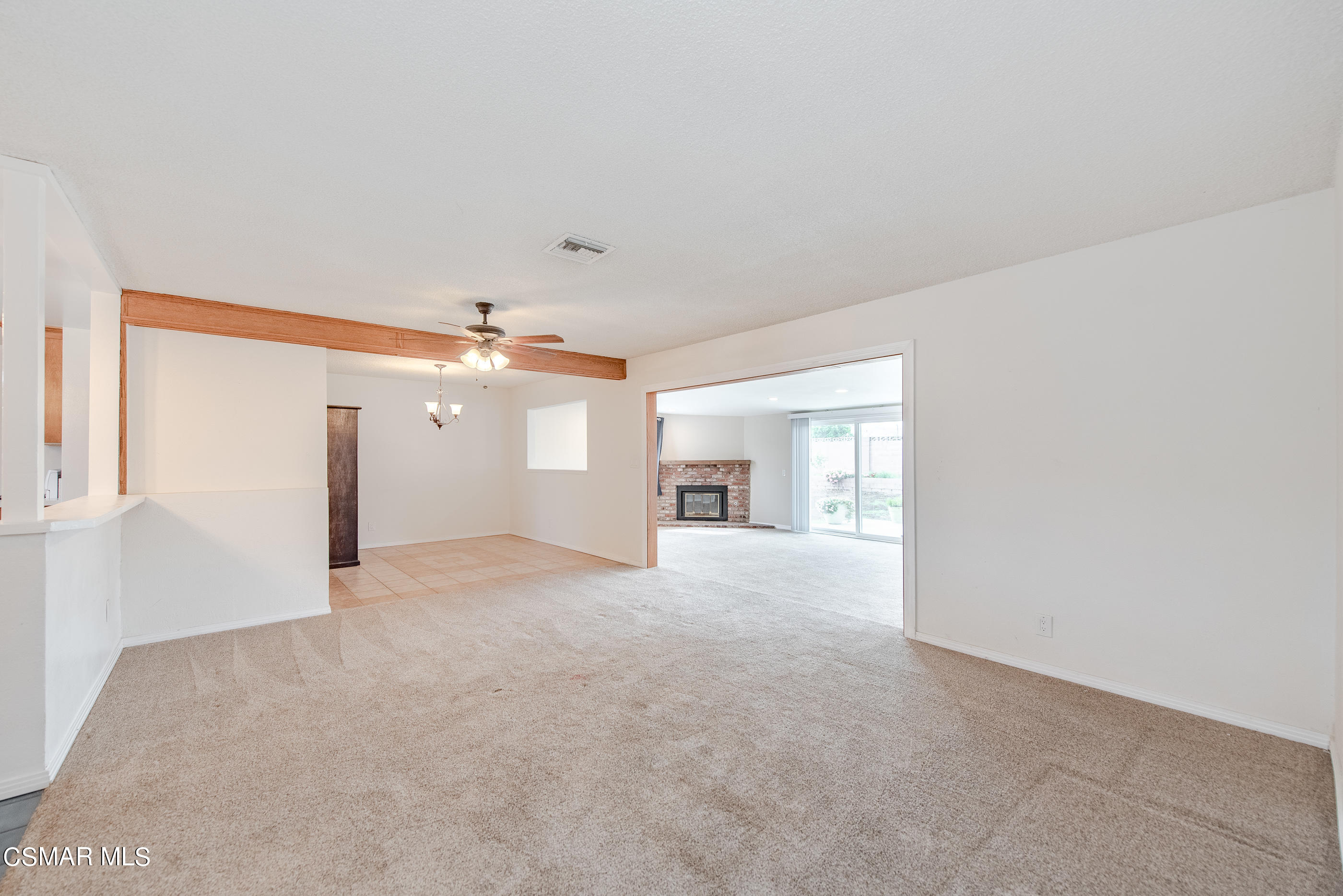1858 Sutter Avenue Simi Valley, CA 93065 - Photo 8 of 24 a view of a big room with windows and chandelier fan