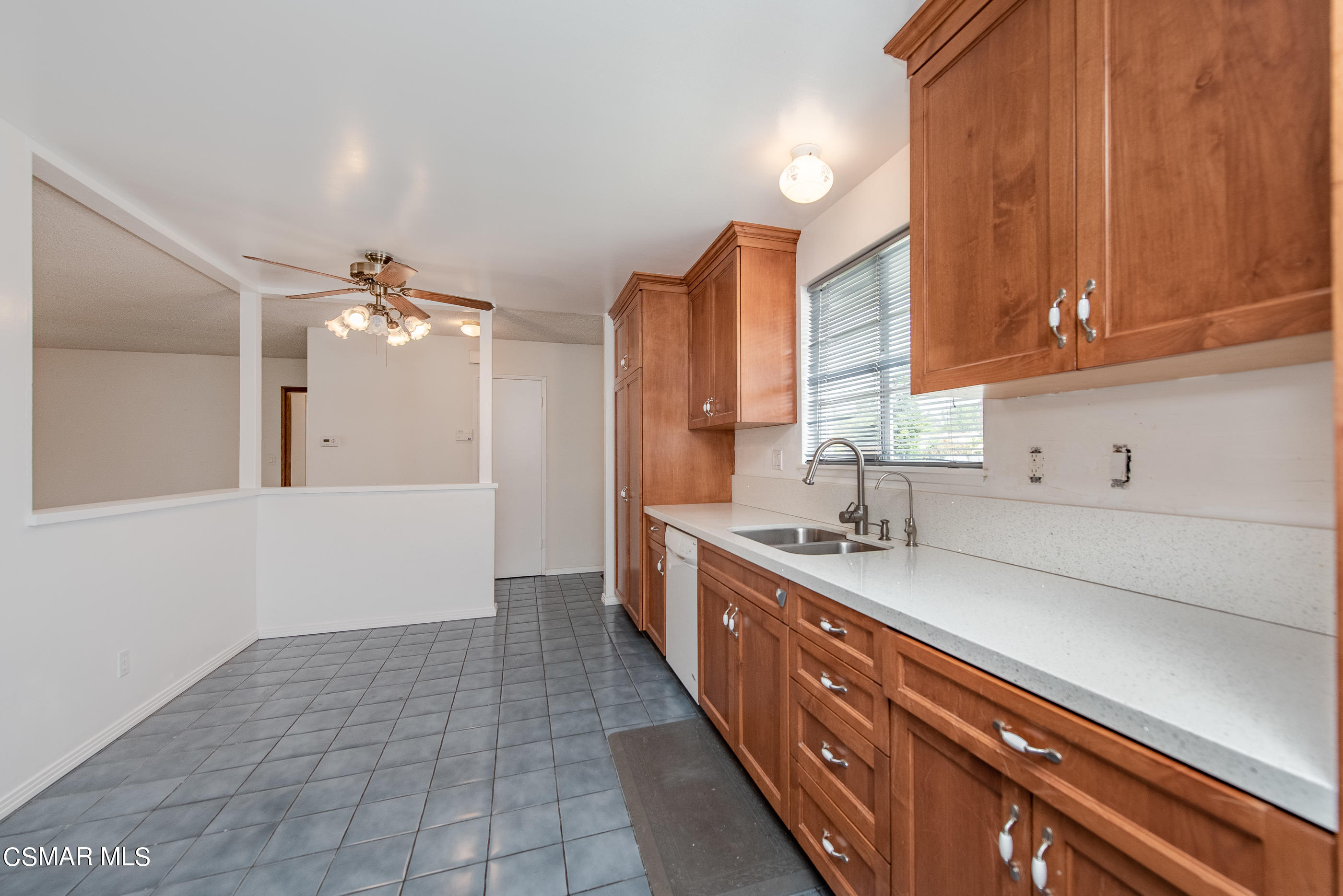 1858 Sutter Avenue Simi Valley, CA 93065 - Photo 10 of 24 a kitchen with a sink and cabinets