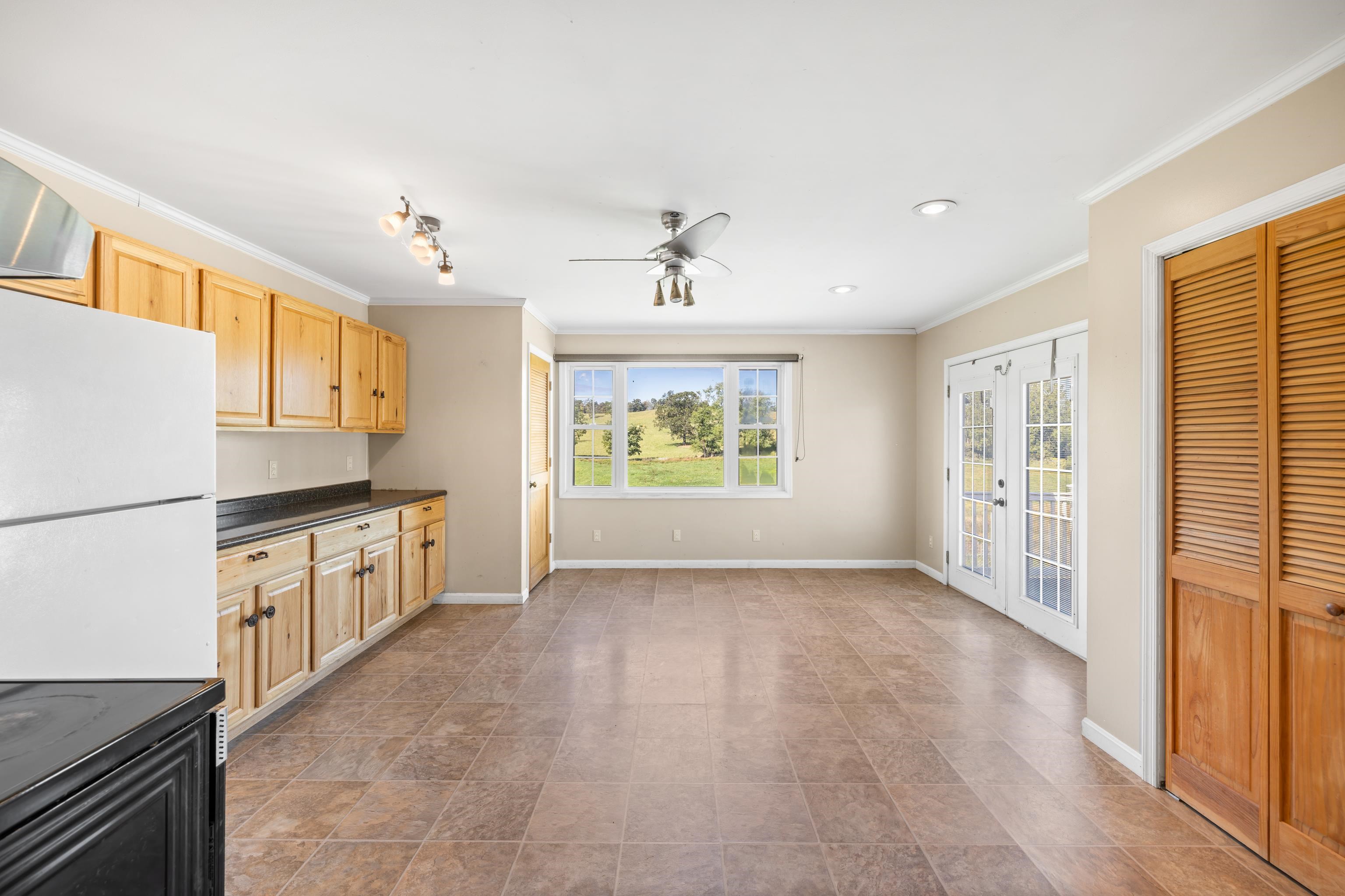 146 Mish Barn Road Middlebrook, VA 24459 - Photo 15 of 54 a large white kitchen with stainless steel appliances granite countertop a refrigerator and a stove top oven
