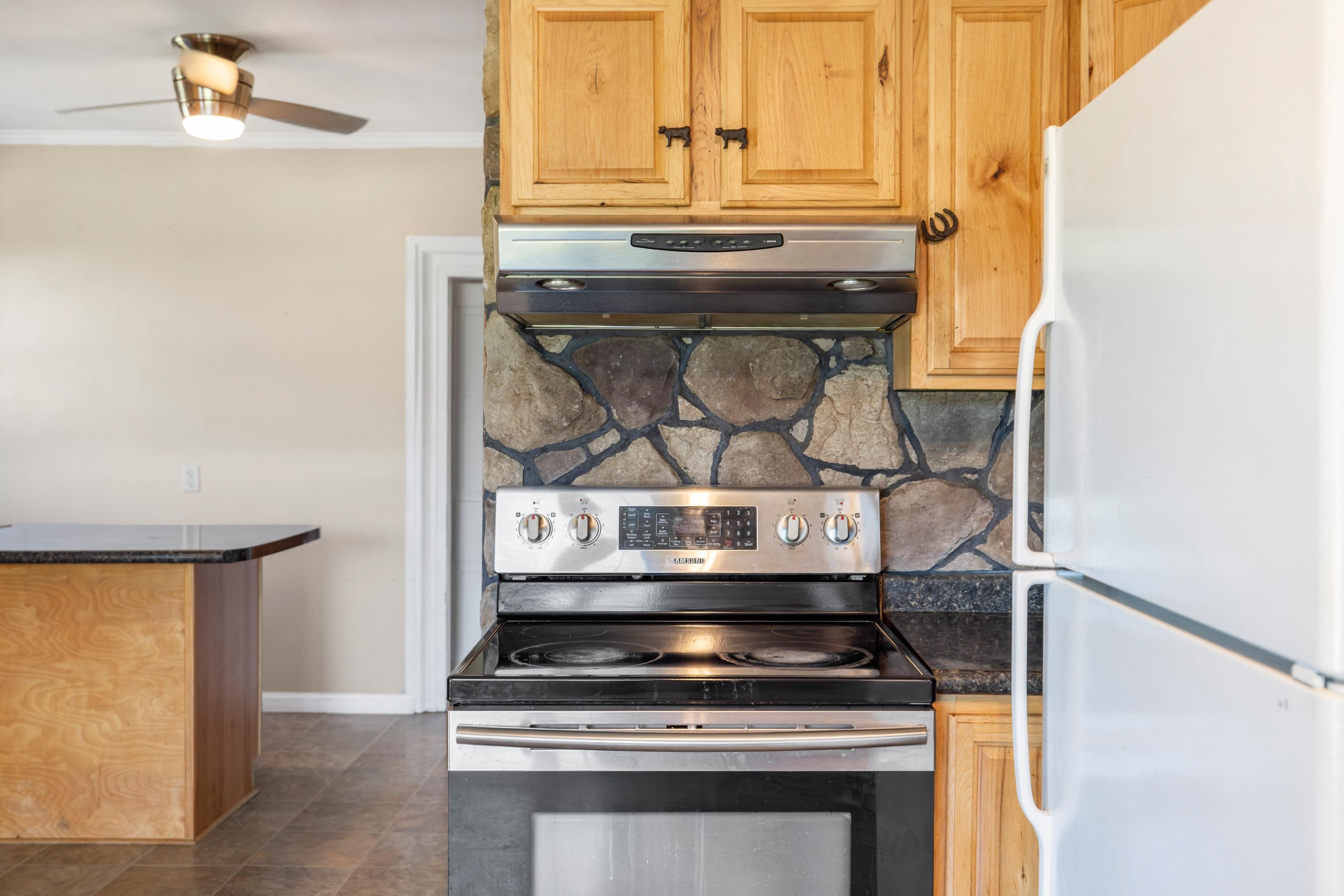 146 Mish Barn Road Middlebrook, VA 24459 - Photo 17 of 54 a stove top oven sitting inside of a kitchen