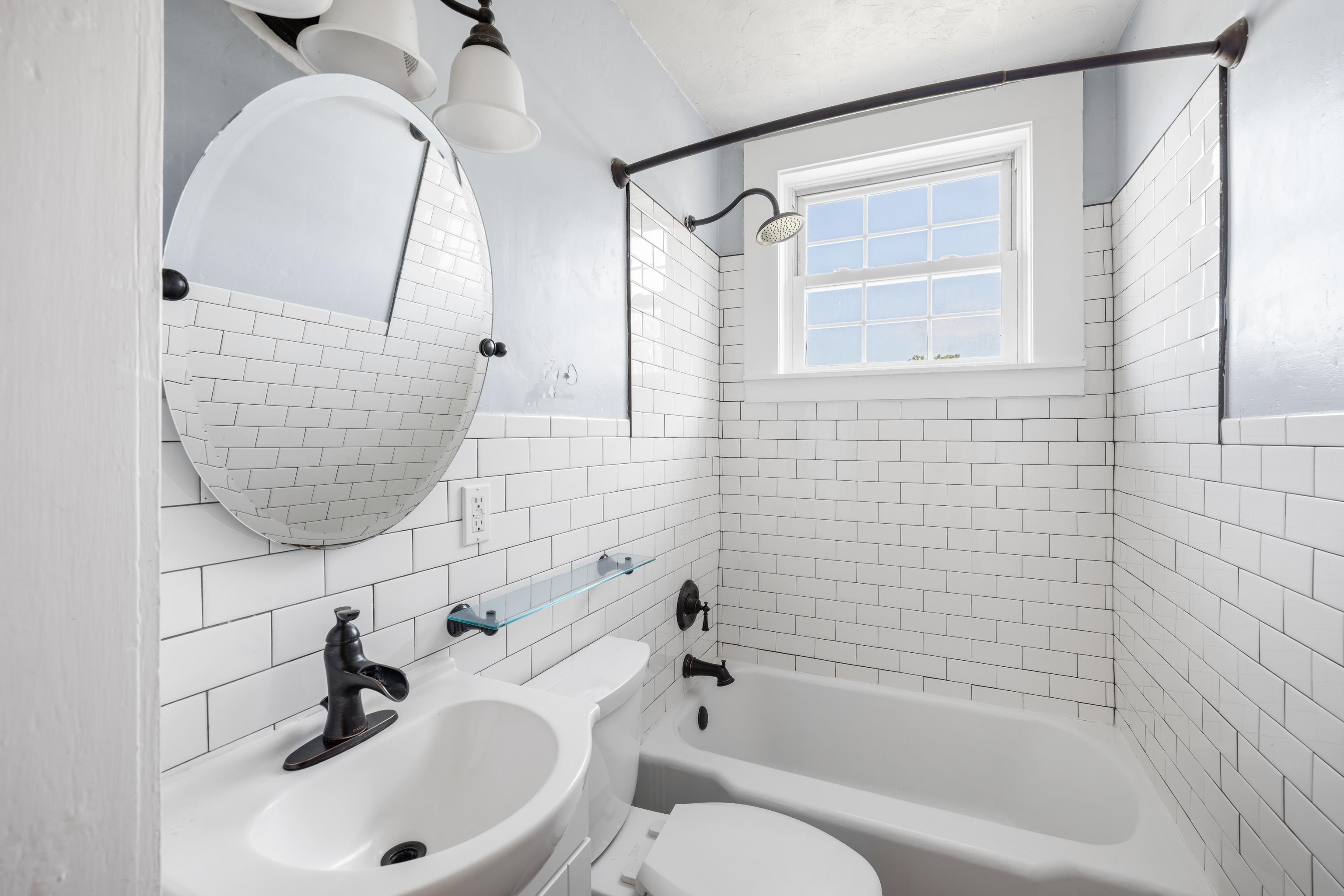 146 Mish Barn Road Middlebrook, VA 24459 - Photo 23 of 54 a bathroom with a sink a toilet and shower