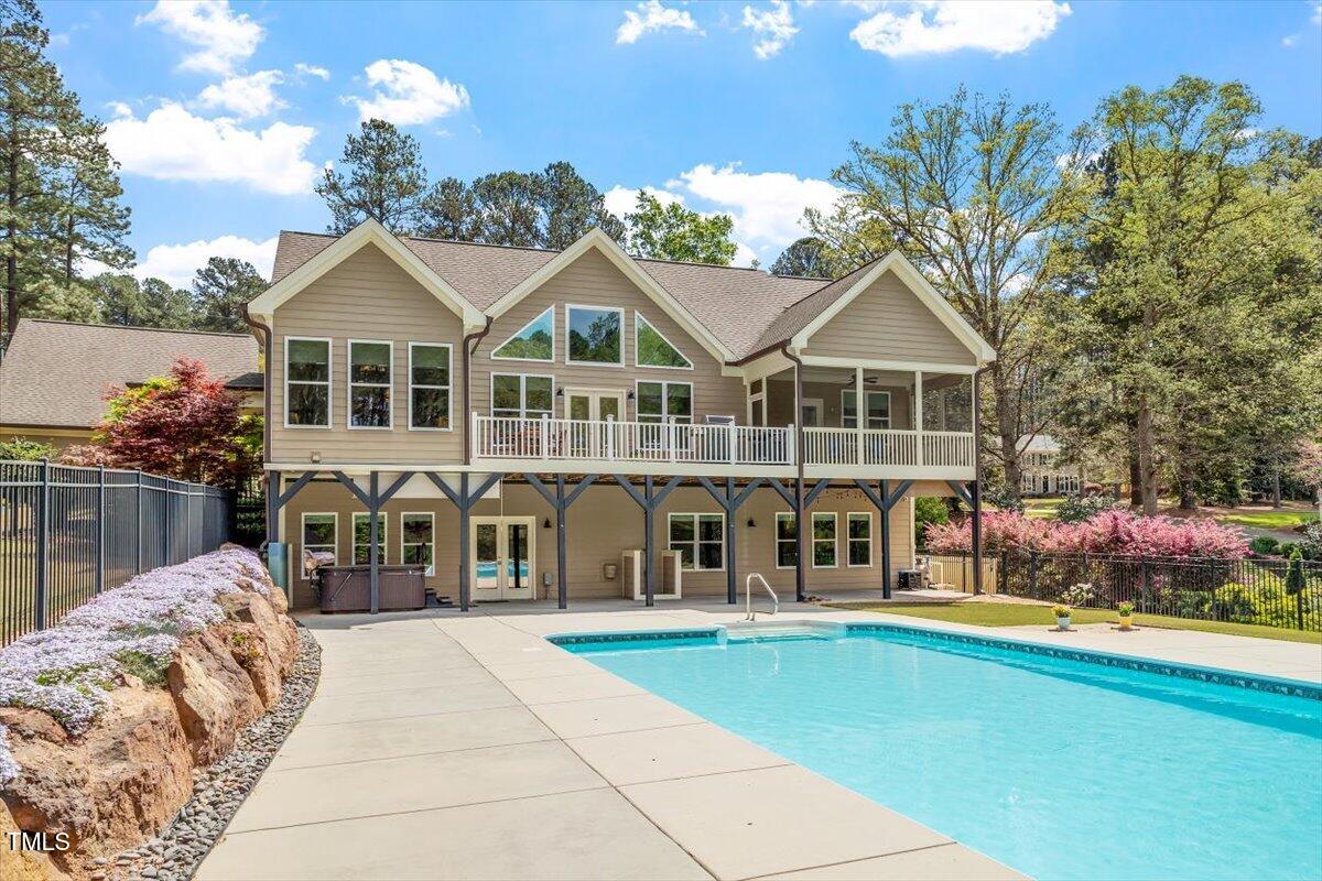 a view of a house with swimming pool