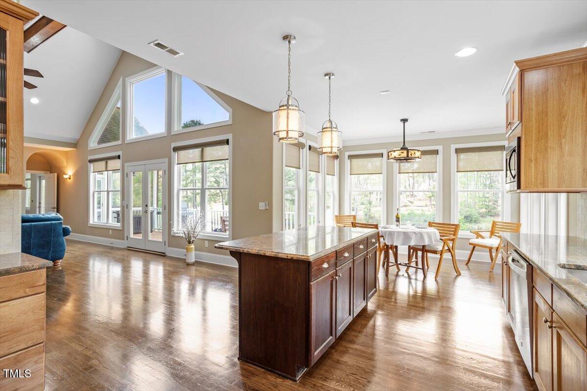1422 Gormly Circle Sanford, NC 27330 - Photo 14 of 59 a view of a large kitchen with furniture and floor to ceiling windows