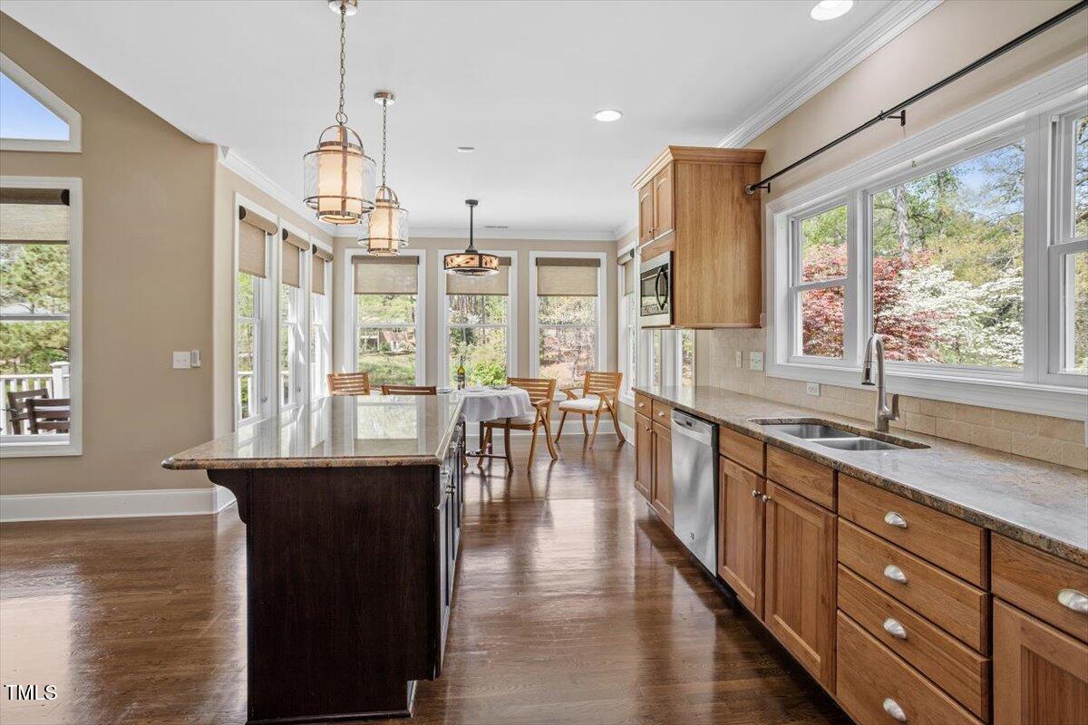 1422 Gormly Circle Sanford, NC 27330 - Photo 16 of 59 a large kitchen with granite countertop a large window and stainless steel appliances