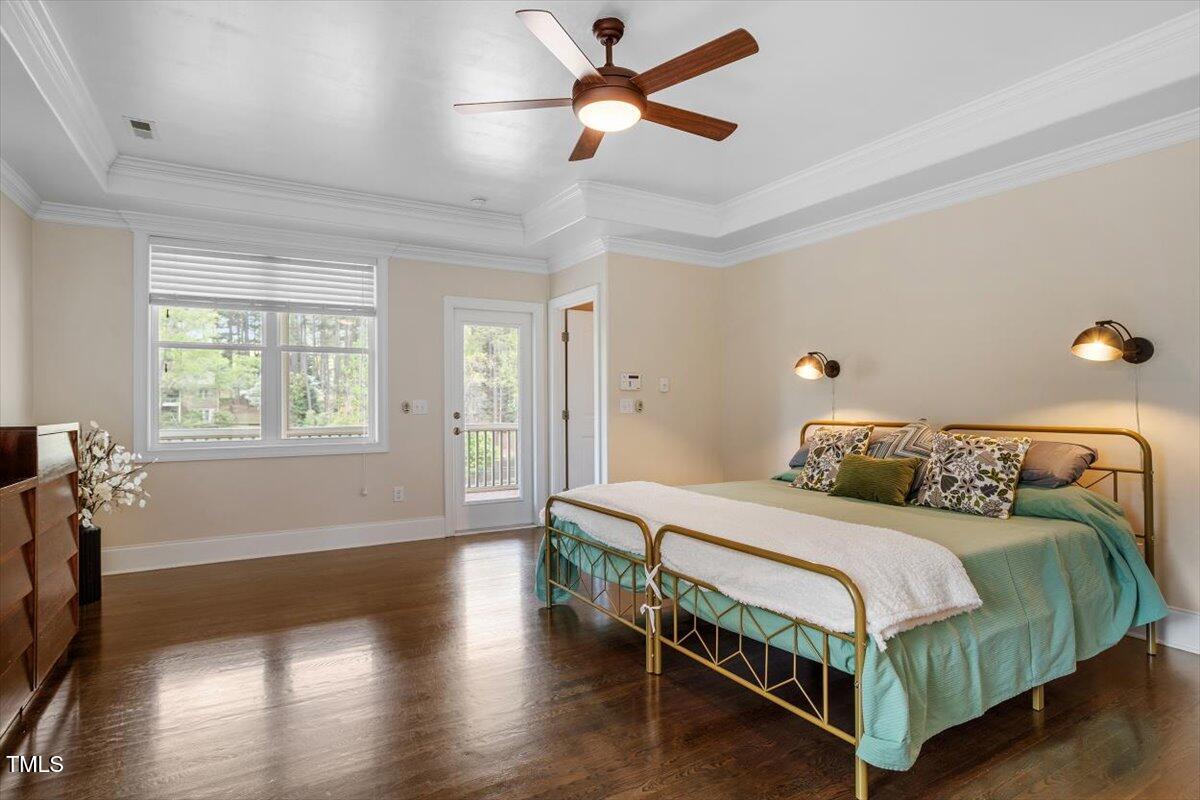 1422 Gormly Circle Sanford, NC 27330 - Photo 18 of 59 a bedroom with a bed chandelier and a window