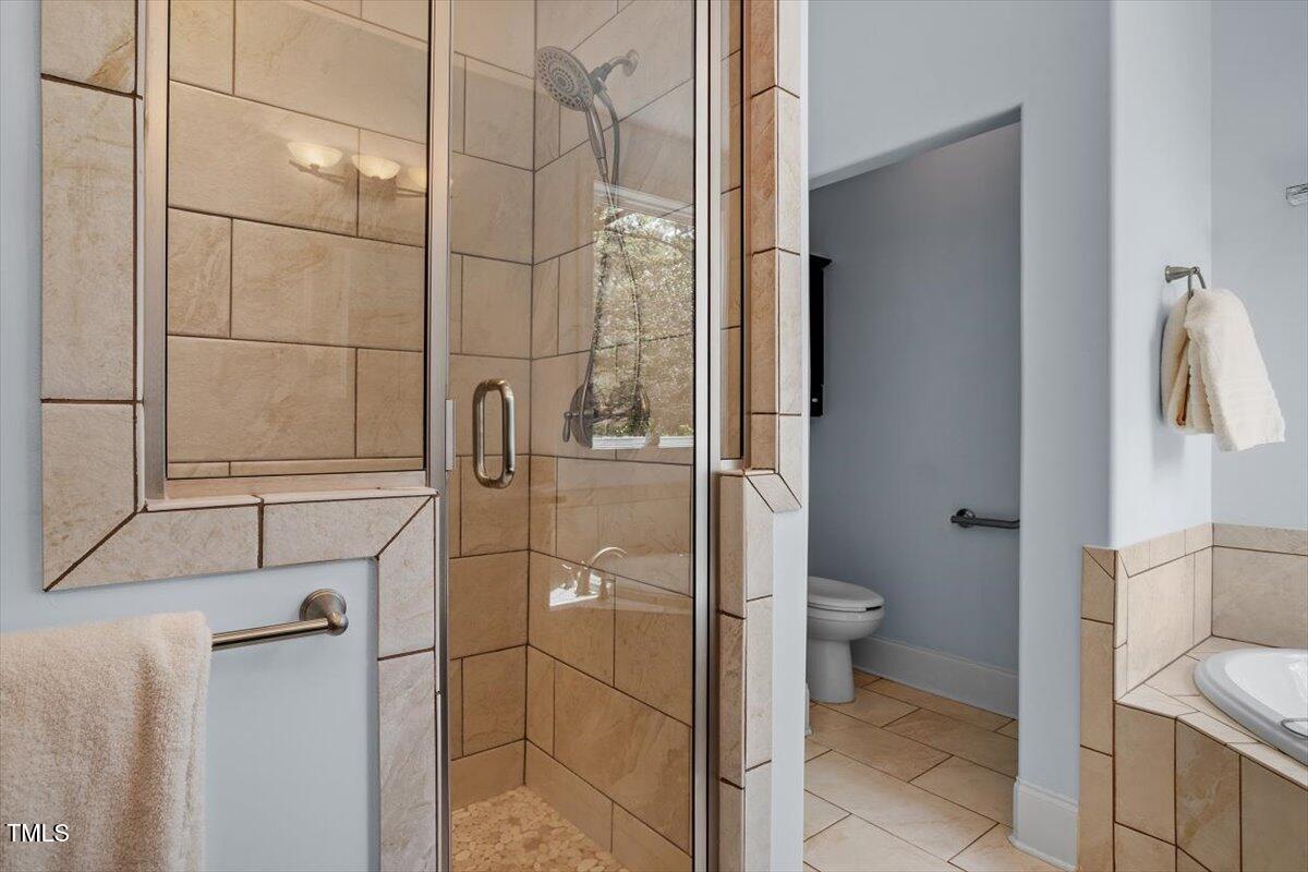 1422 Gormly Circle Sanford, NC 27330 - Photo 22 of 59 a bathroom with a toilet and a shower