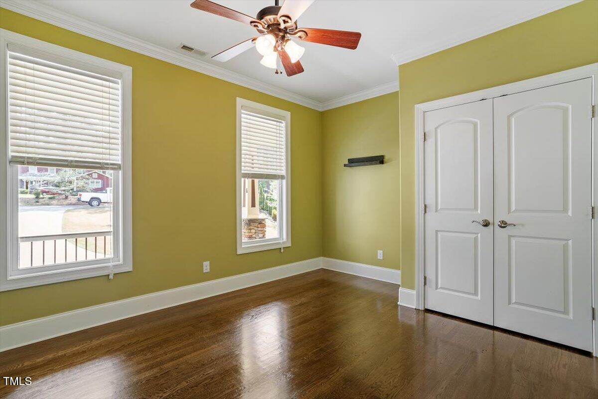 1422 Gormly Circle Sanford, NC 27330 - Photo 23 of 59 a view of an empty room with window and wooden floor