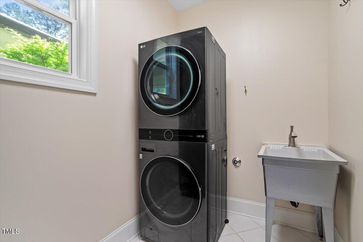 1422 Gormly Circle Sanford, NC 27330 - Photo 25 of 59 a utility room with dryer and washer