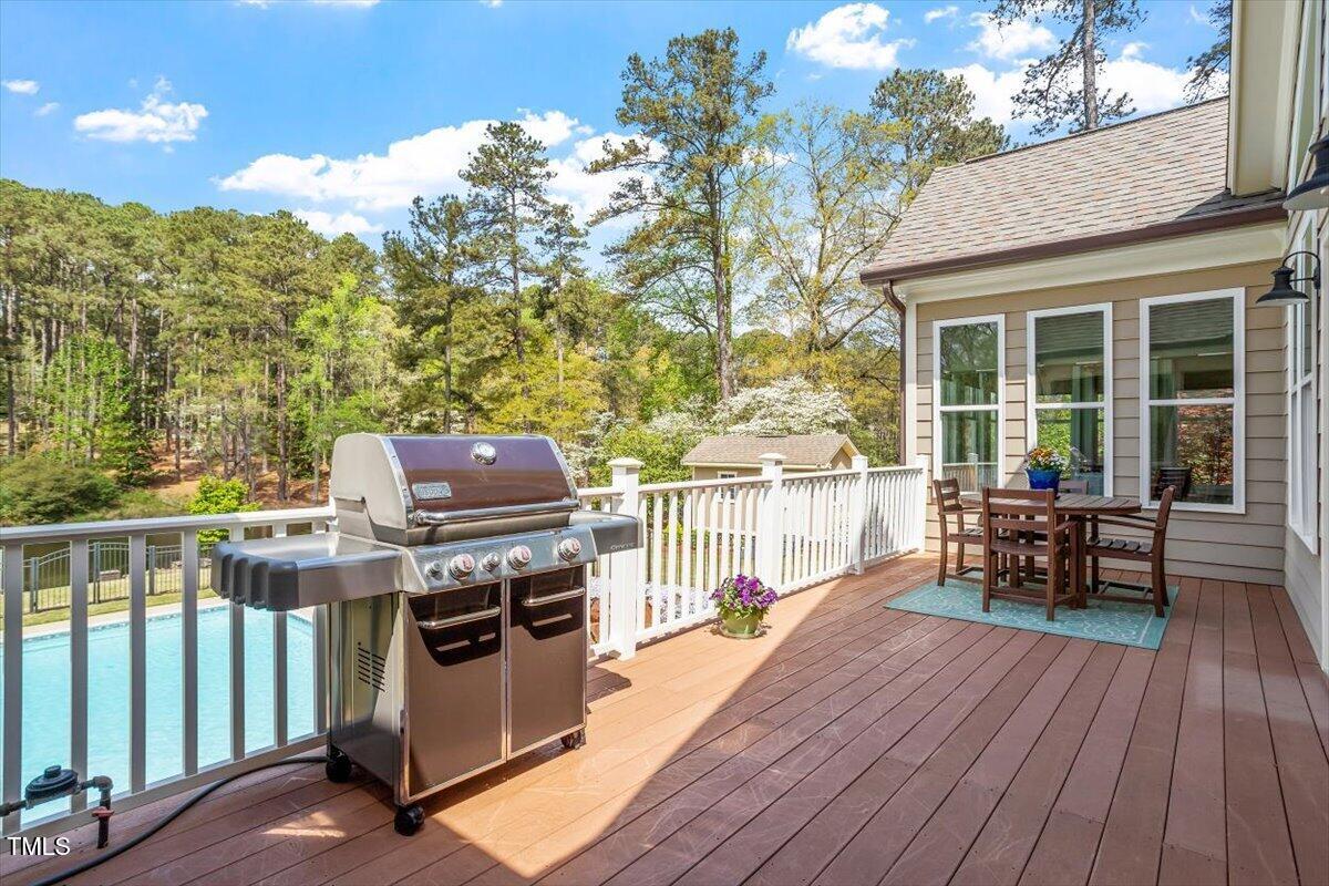 1422 Gormly Circle Sanford, NC 27330 - Photo 27 of 59 a view of a chairs and table on the wooden deck