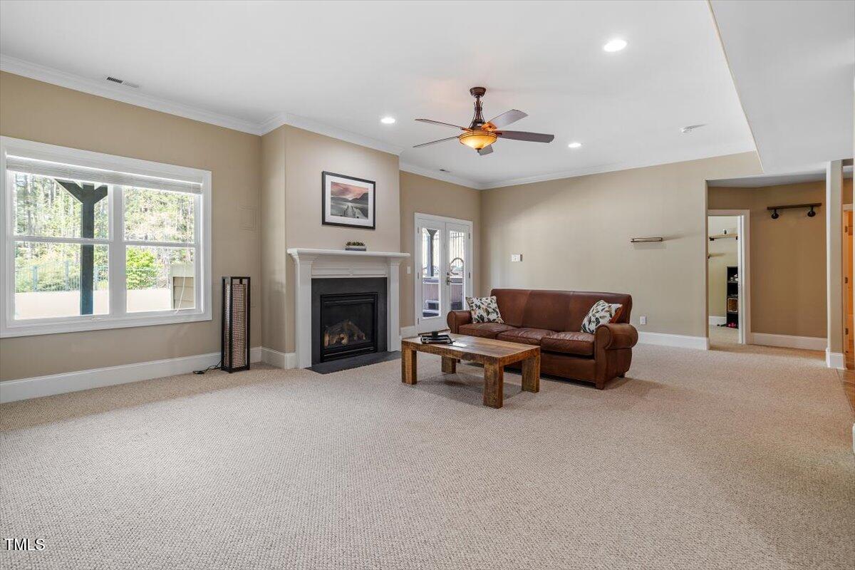 1422 Gormly Circle Sanford, NC 27330 - Photo 28 of 59 a living room with furniture and a fireplace