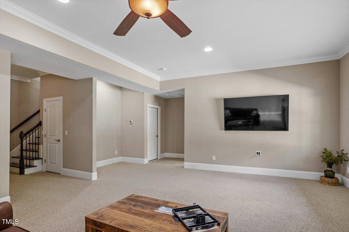1422 Gormly Circle Sanford, NC 27330 - Photo 30 of 59 a living room with furniture and a flat screen tv