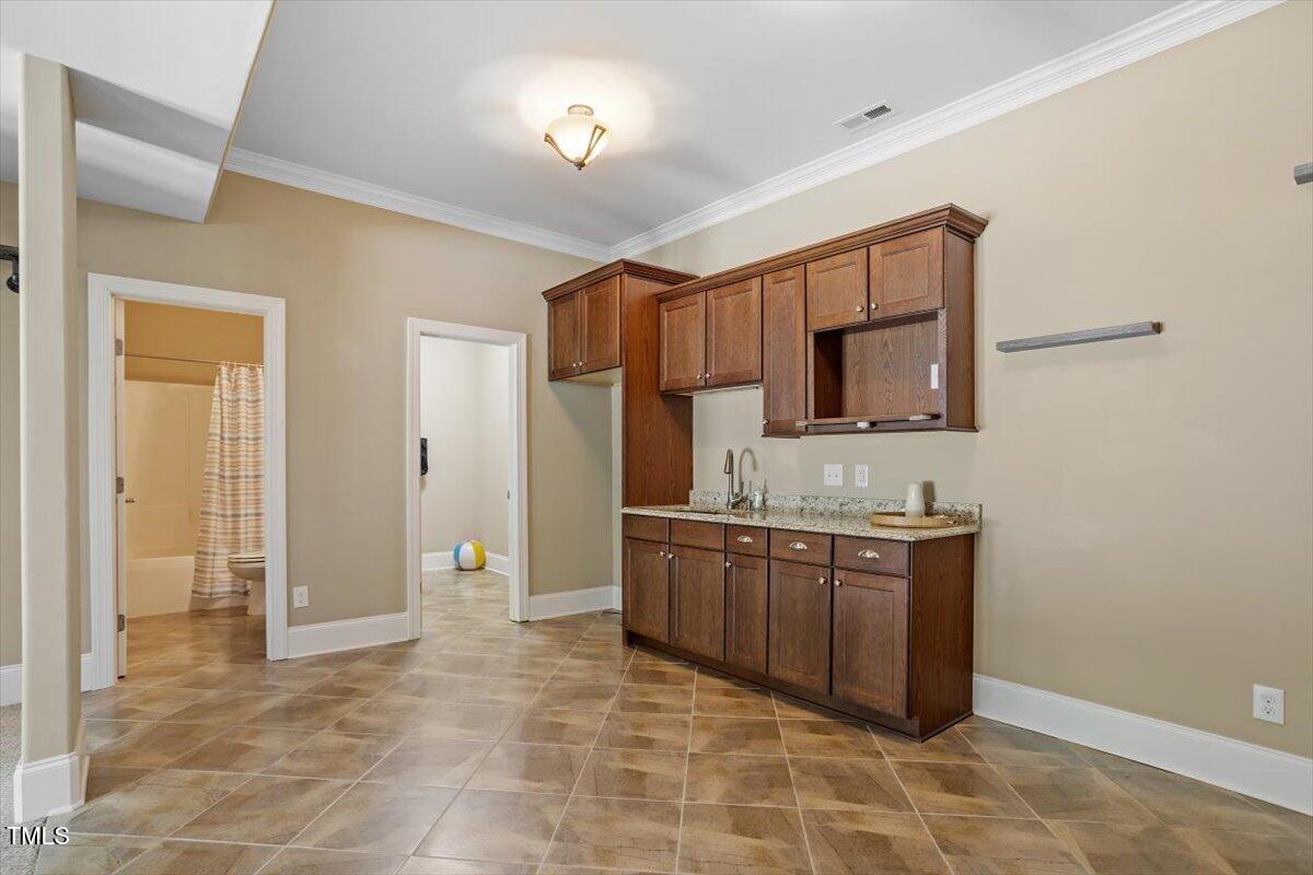 1422 Gormly Circle Sanford, NC 27330 - Photo 35 of 59 a large bathroom with a sink and a mirror