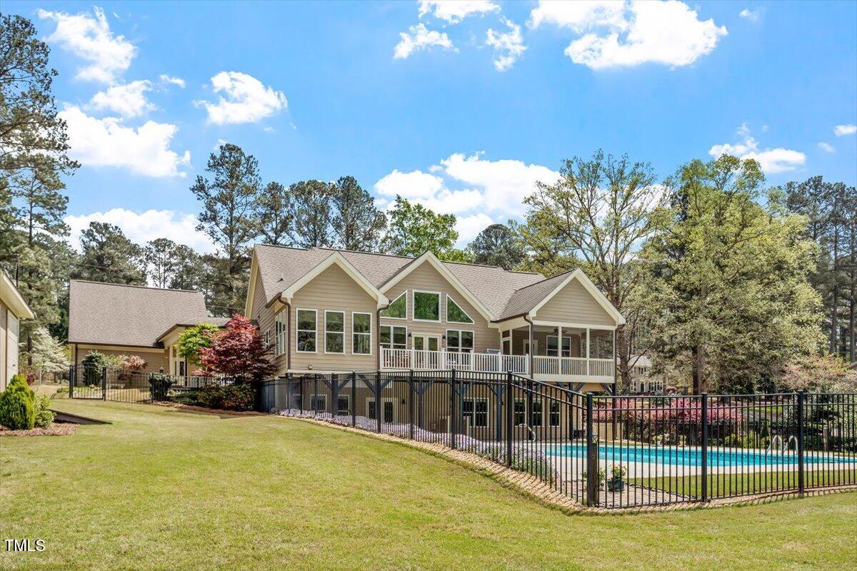 1422 Gormly Circle Sanford, NC 27330 - Photo 41 of 59 a front view of a house with swimming pool yard and outdoor seating