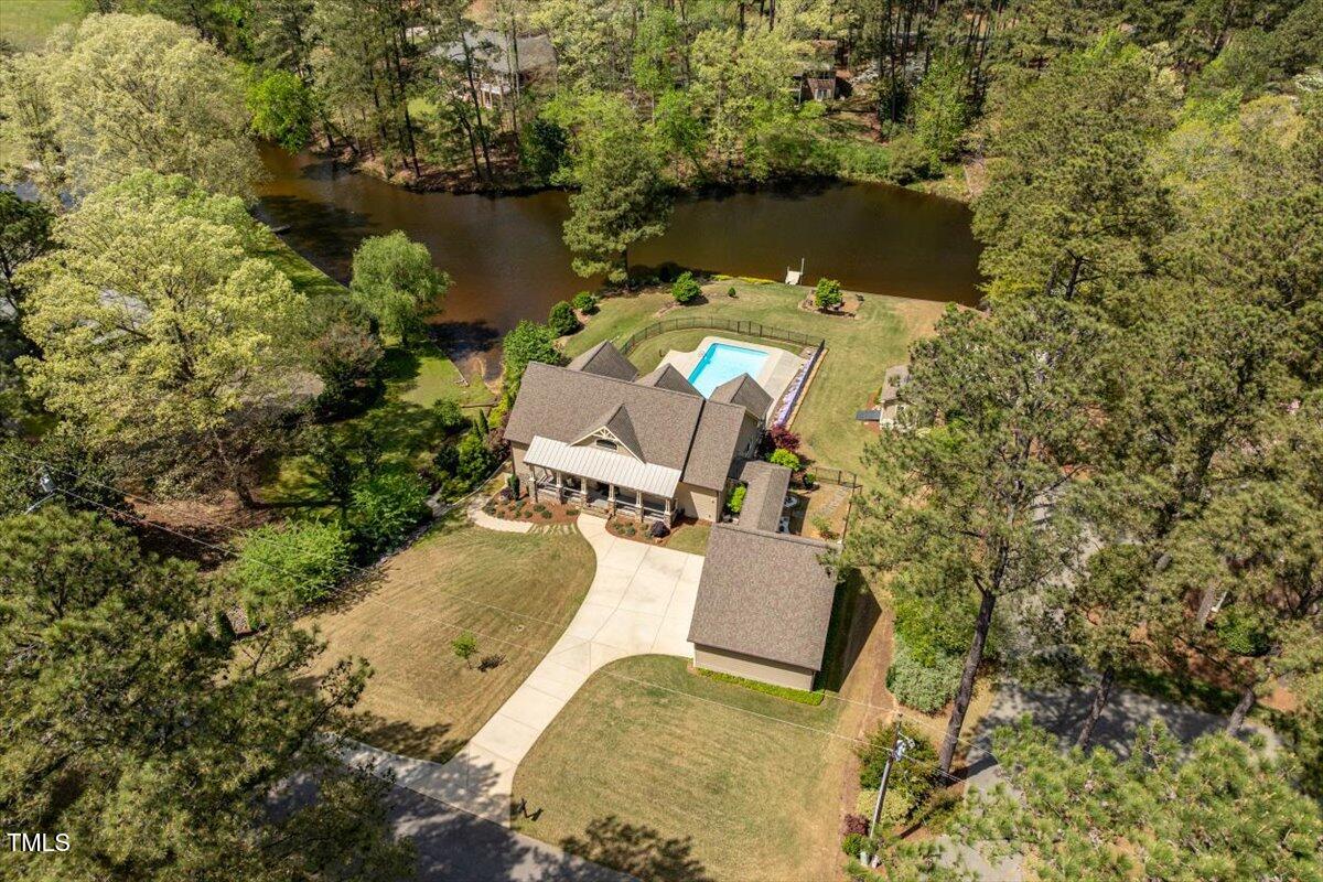 1422 Gormly Circle Sanford, NC 27330 - Photo 57 of 59 an aerial view of a house with a yard and lake view