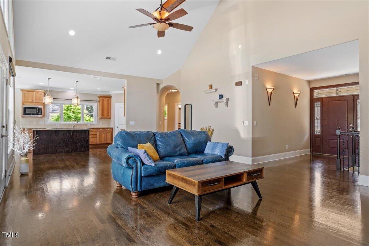 1422 Gormly Circle Sanford, NC 27330 - Photo 9 of 59 a living room with furniture and a wooden floor