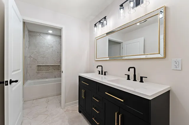 a bathroom with a toilet and a bathtub