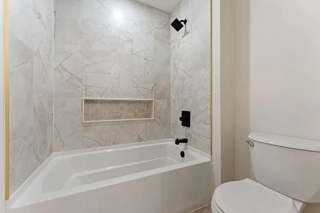 a view of a livingroom with furniture and wooden floor