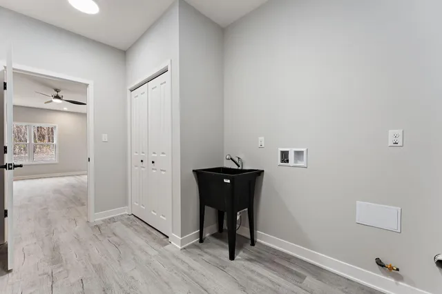 a large house with a beach in front of it