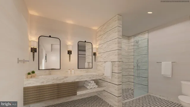 a bathroom with double vanity and a mirror