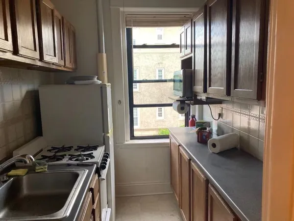 a kitchen with a window a sink and a window