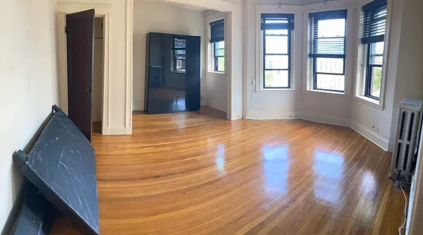 a kitchen with a sink appliances and cabinets