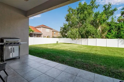 an aerial view of residential houses with outdoor space and street view